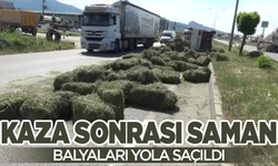 Kaza yapan kamyondaki saman balyaları yola saçıldı