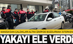 Manisa'dan çaldıkları altını İzmir'de bozdurmak isteyen 2 şüpheliden biri yakalandı