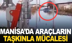 Manisa'da sel suları arasında yüzen araç