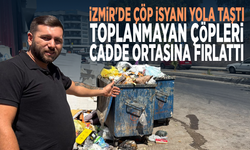 İzmir'de çöp isyanı yola taştı: Toplanmayan çöpleri cadde ortasına fırlattı