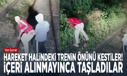Hareket halindeki trenin önünü kestiler! İçeri alınmayınca taşladılar