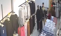 Küçük çocukla girdiği mağazadan kıyafet çaldı